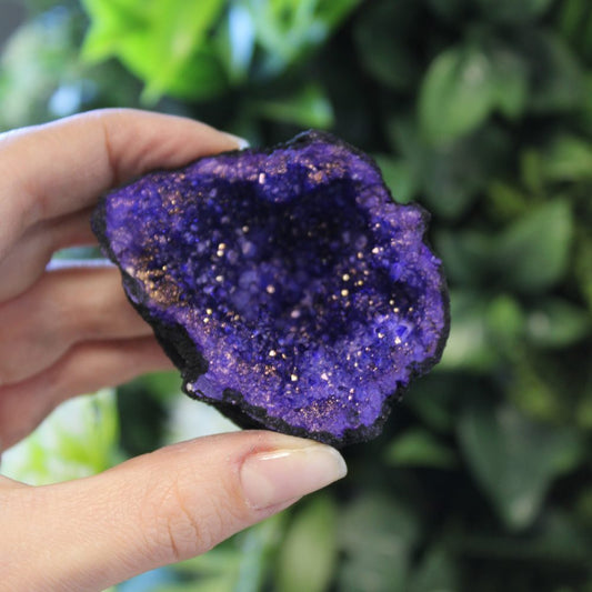 Coloured Calcite Geodes Black Rock Turquoise & Purple natural split geode with vibrant crystal interior