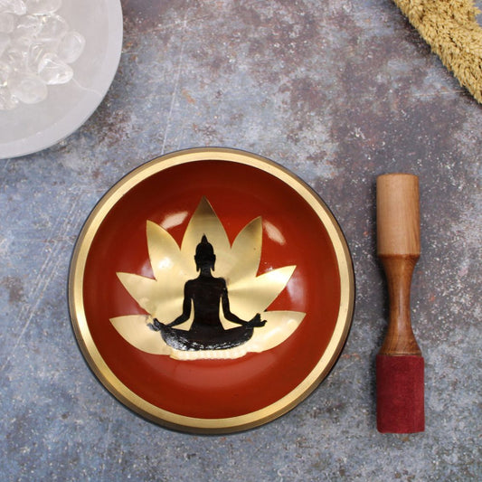 Buddha Singing Bowl Set – 14 cm black and orange metal bowl with Buddha design, cushion and wooden striker.