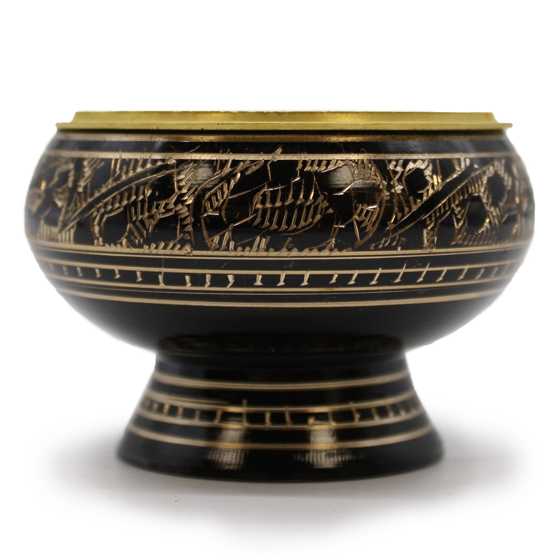 A black, intricately engraved bowl with gold floral patterns sits on a short pedestal base, set against a white background, highlighting its decorative craftsmanship and brass rim.