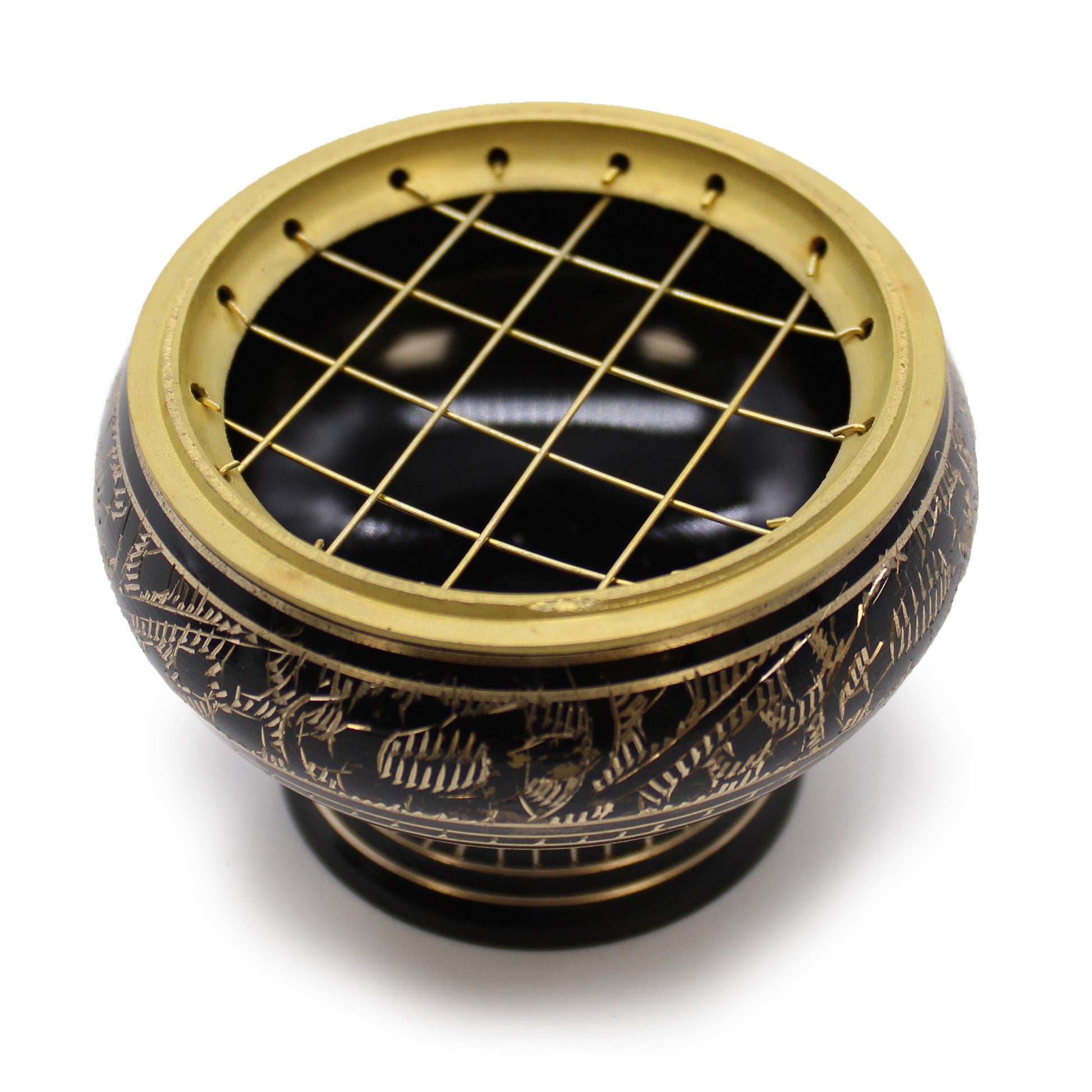 A decorative, black and gold charcoal burner features intricate engravings and a gold mesh cover. It rests prominently against a plain white background, highlighting its ornate design.