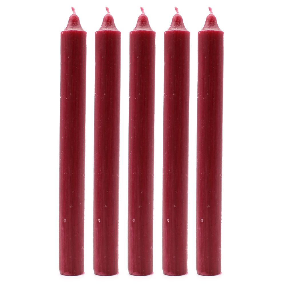 Five burgundy, cylindrical candles stand upright in a row on a white surface, their tapered tops pointing upward.
