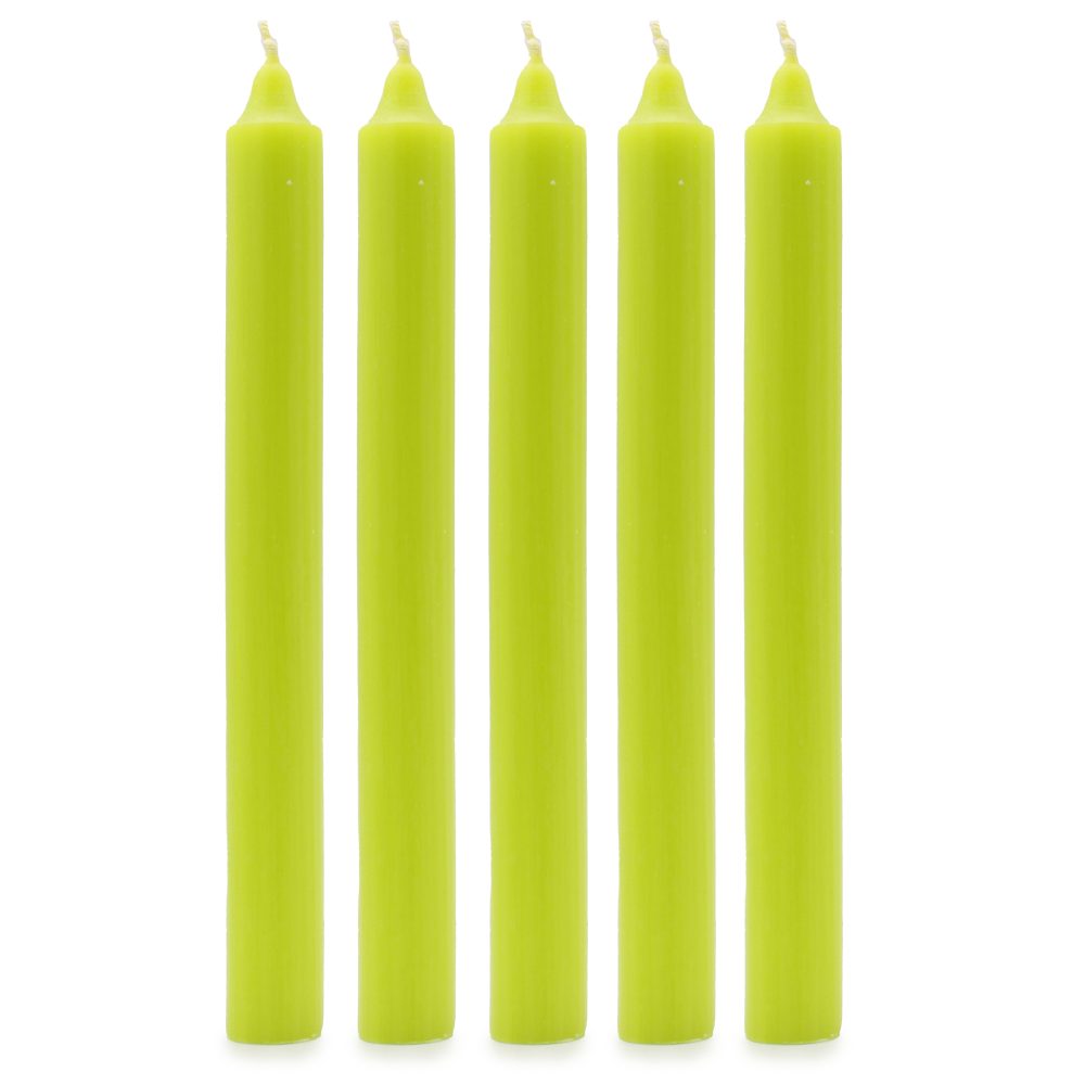 Five unlit, chartreuse taper candles stand upright in a row on a white surface.
