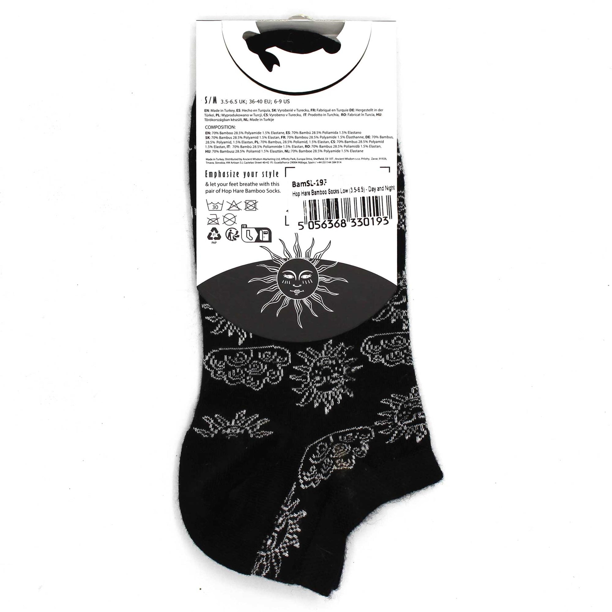 Black socks with a silver sun and cloud pattern are shown on a white background.  The socks are packaged with a tag providing details of composition, size (S/M 3.5-6.5 UK; 36-40 EU; 6-9 US), and care instructions.  The tag also includes the product name "Hop Hare Bamboo Socks Low (3.5-6.5) - Day and Night" and a barcode: 5 056368 330193.