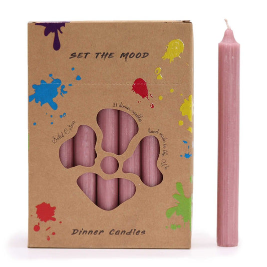 Dinner candles are displayed in a decorated box next to a single candle; the box reads, “SET THE MOOD”, “Solid Colour”, “21 dinner candles”, “hand made in the Uk”, and "Dinner Candles".