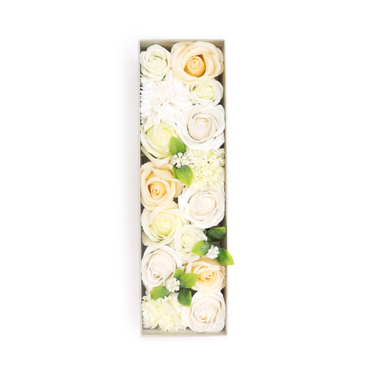 Artificial flowers, arranged as the letter "I," fill a rectangular box against a white background.