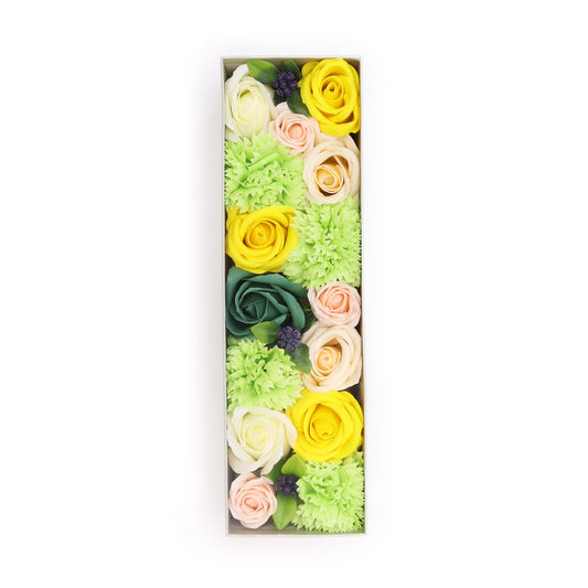 Soap flowers, arranged as the letter "I," are contained within a rectangular box against a white background.
