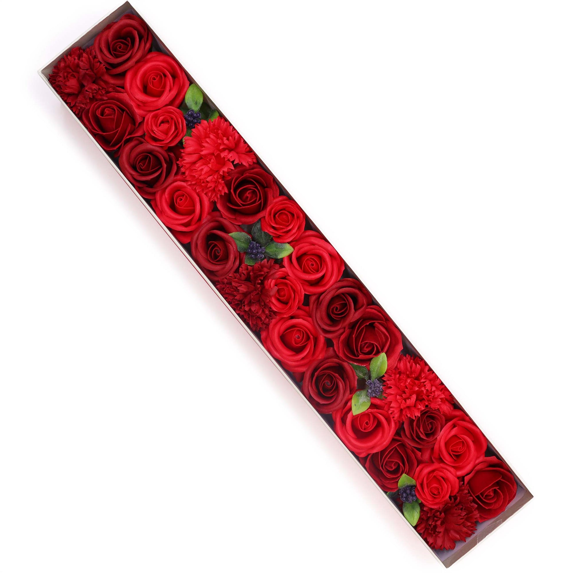 A long, rectangular box containing numerous red roses and carnations is arranged on a white background.