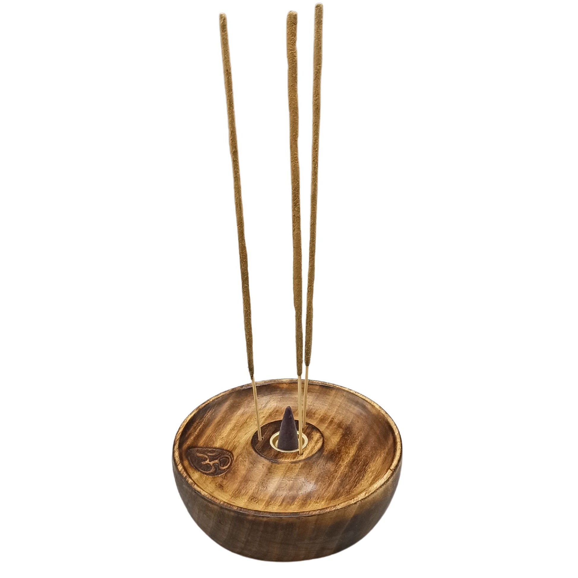 Wooden incense holder with three unlit incense sticks and a cone, engraved with the Om symbol, placed on a smooth, rounded base. Background is plain white.