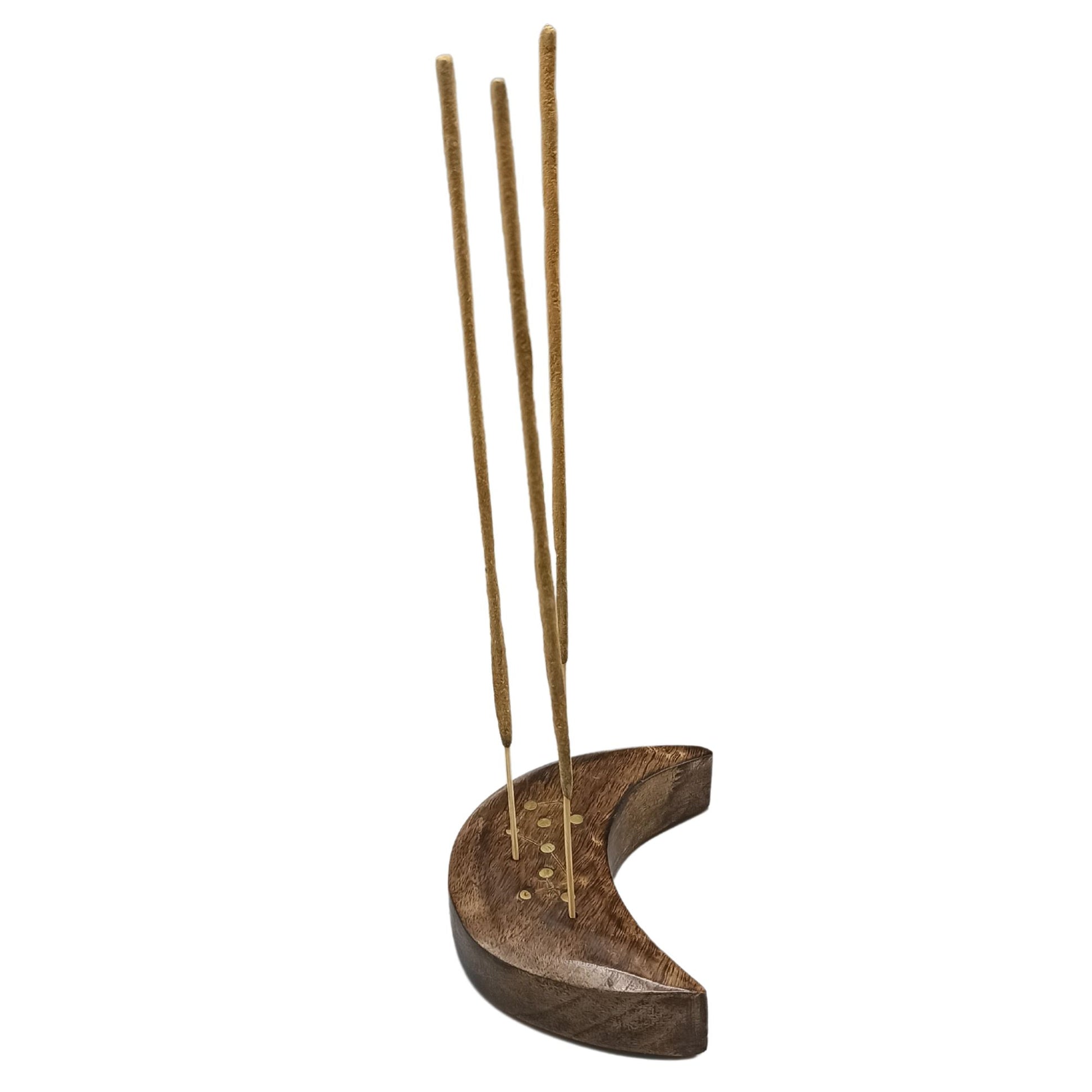 Wooden crescent-shaped holder supports several vertical incense sticks. The holder, decorated with small circular inlays, is set against a plain white background.