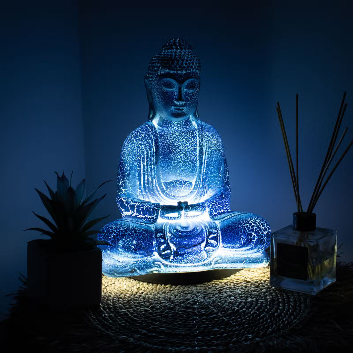Sky Blue Meditation Buddha lamp with cool blue crackle glow and black oval stand UK