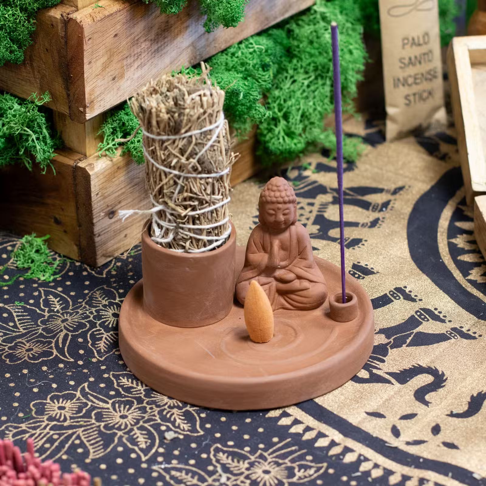 Natural terracotta style ceramic Buddha incense plate with seated Buddha and holders for incense sticks and cones