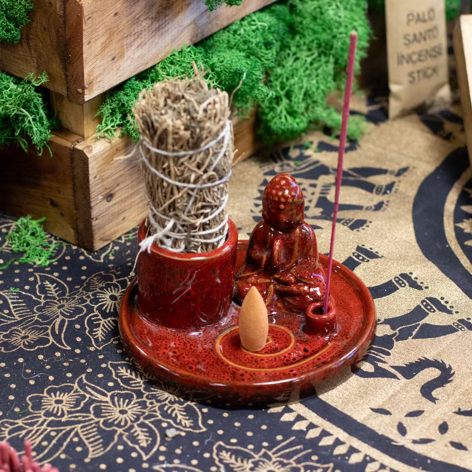 Soft red ceramic Buddha incense plate with seated Buddha and holders for incense sticks and cones