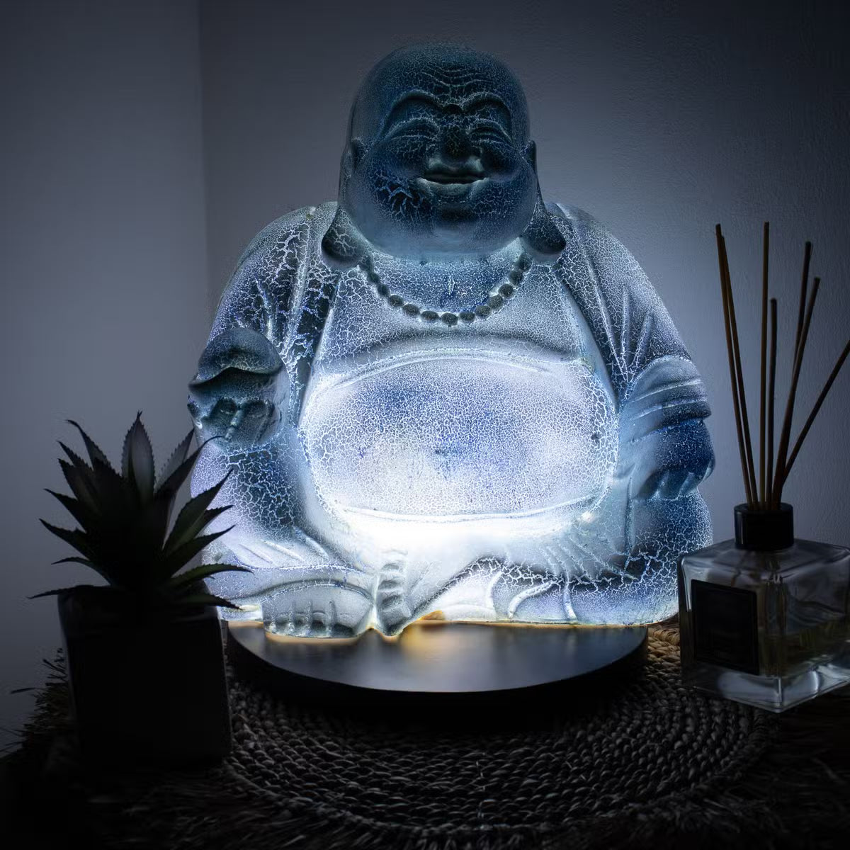 Sky Blue Laughing Buddha lamp with cool blue crackle glow and black round stand UK