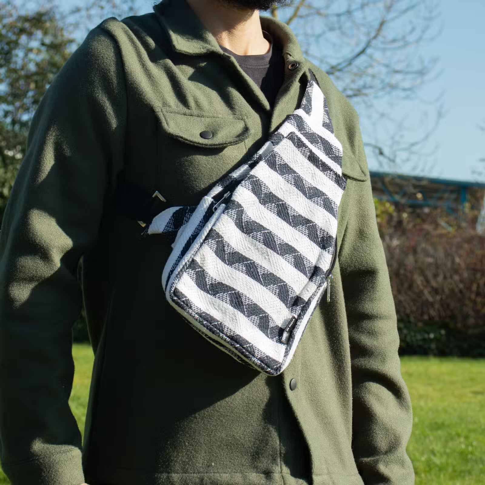 Atlas Nomad crossbody bag in natural cotton-viscose jacquard with bold woven geometric pattern