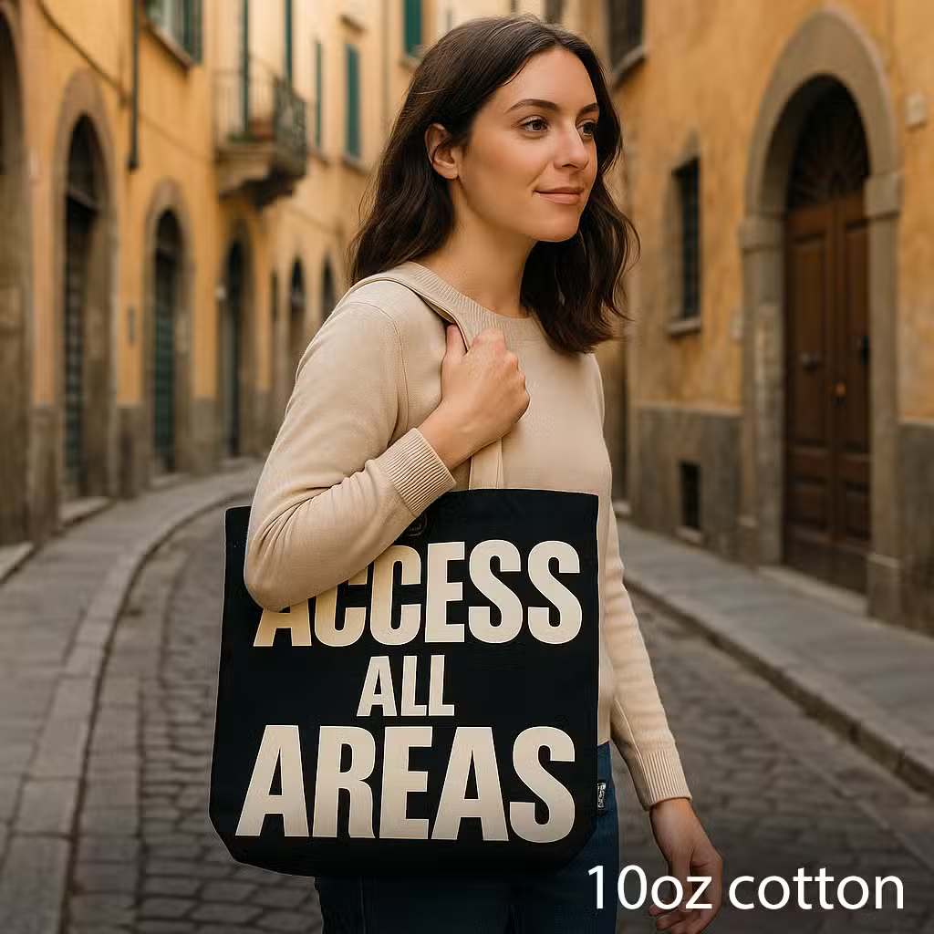 Access All Areas black and natural 10oz cotton tote bag with boxed base and button fastening.