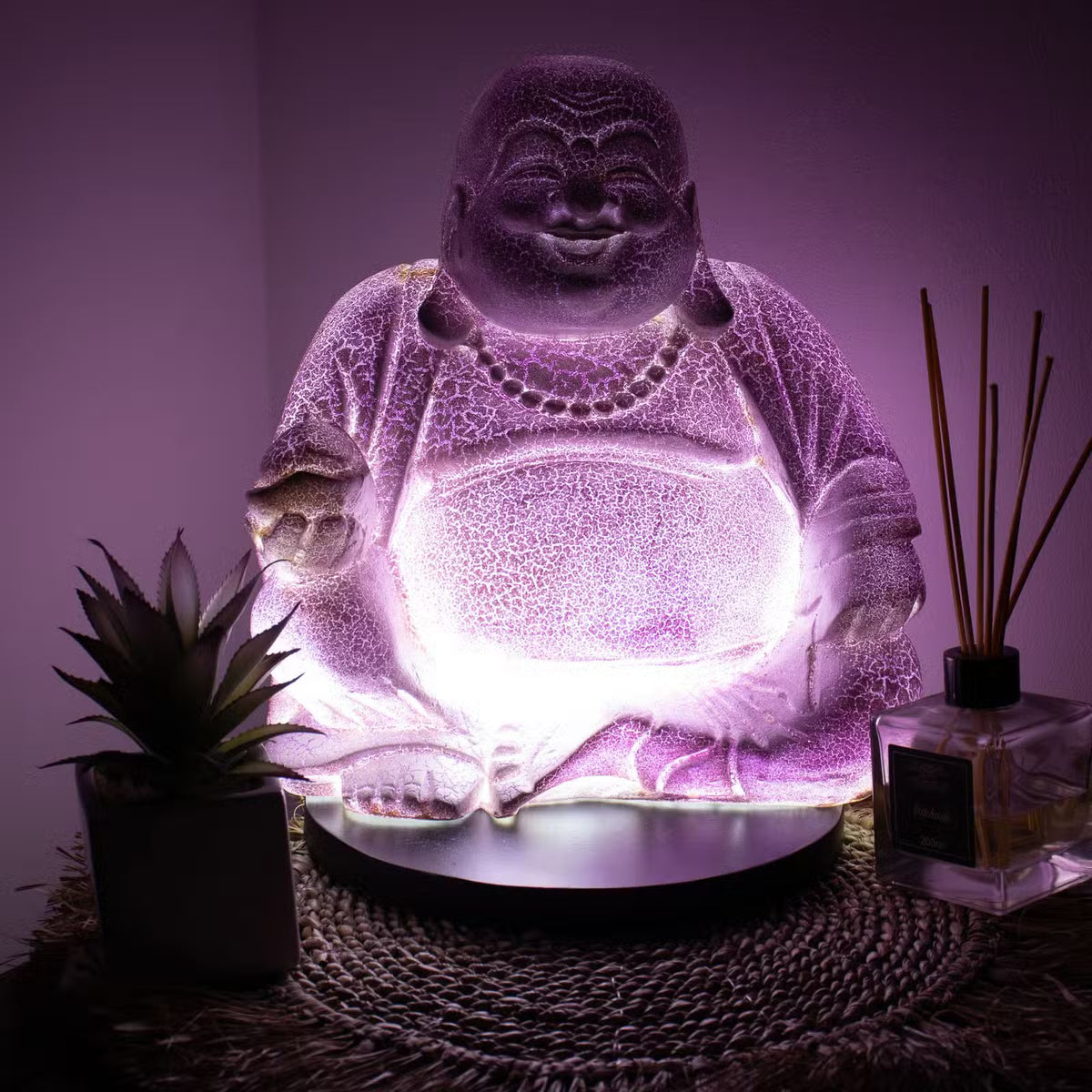 Lavender Laughing Buddha lamp with soft purple crackle glow and black round stand UK