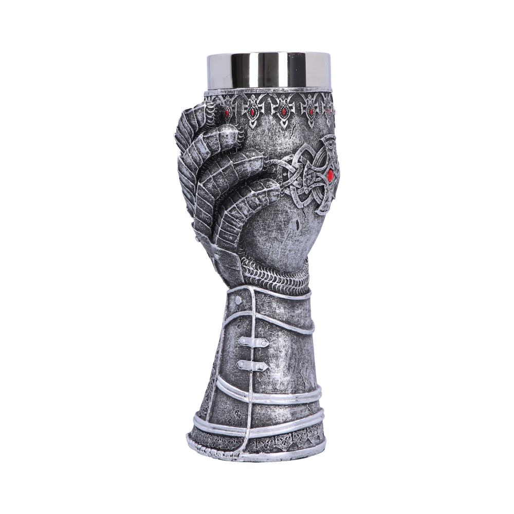 A silver gauntlet-shaped goblet stands upright on a white background. It features intricate detailing, including decorative patterns and red gemstone accents. The top is a smooth, reflective metal.