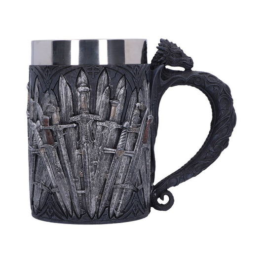 A gray, metal mug features a dragon-shaped handle; swords are arranged around the mug's body, resembling a throne. The mug has a silver-colored rim.
