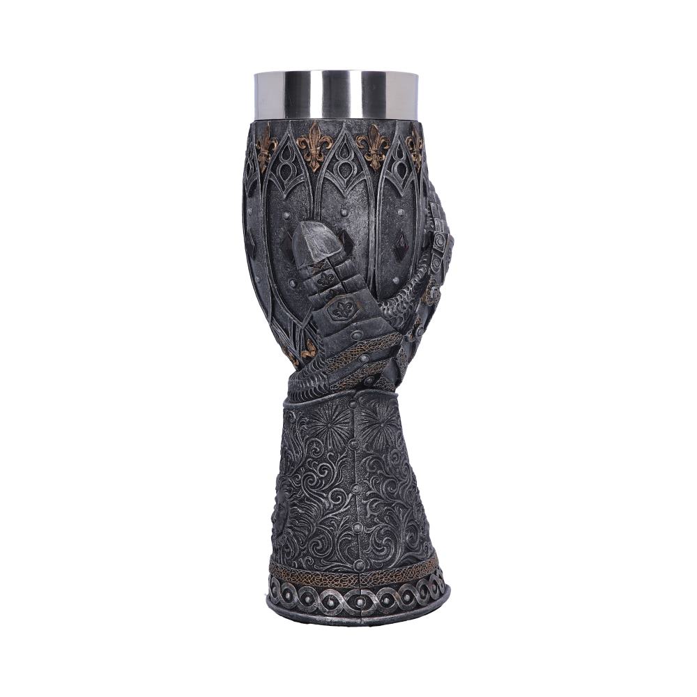 The ornate goblet, featuring a metallic insert, has decorative molding, a shield image, and a gauntlet; it stands upright against a plain white background.