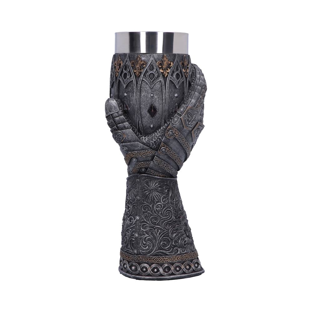 A metal mug is grasped by an ornate, armored gauntlet that forms the mug's body and handle, all against a white background.