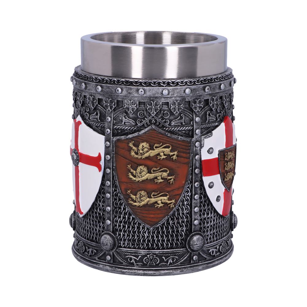 A mug simulates a suit of armor featuring shields, chainmail, and ornamental metalwork, including a central shield emblazoned with three golden lions. The object sits on a plain white surface.