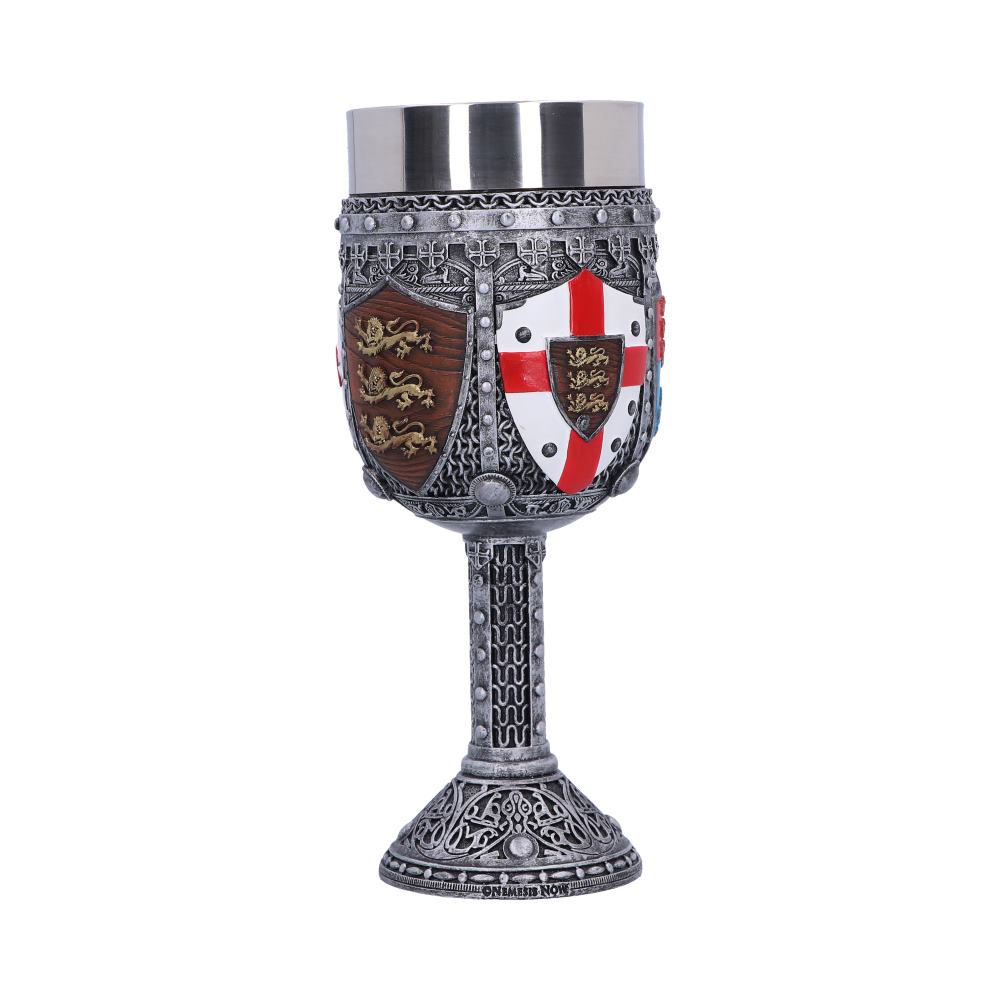 A decorative, silver-colored goblet displays heraldic shields, featuring golden lions on brown and a red cross on white, upon a white surface. "NON BIBEMUS NON" is inscribed on the base.
