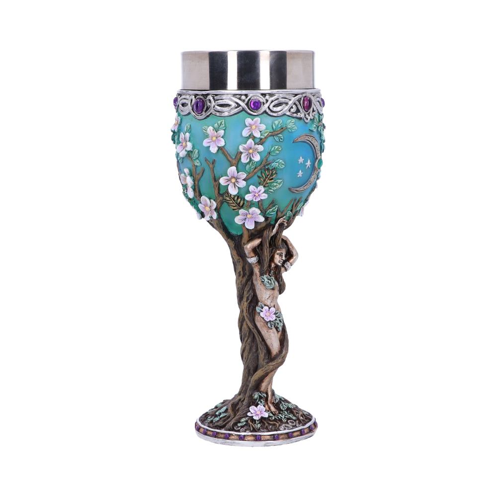 A decorative goblet features a woman molded into a tree trunk base, reaching up to support a blossom-covered, celestial-themed bowl capped with a metallic rim, all on a white background.