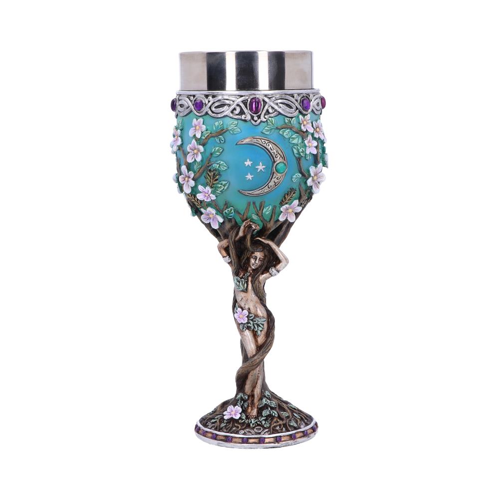 A goblet features a silver-toned cup above an ornate design: a crescent moon and stars against a light-blue, floral-bordered background, supported by a nude female figure intertwined with a tree trunk.