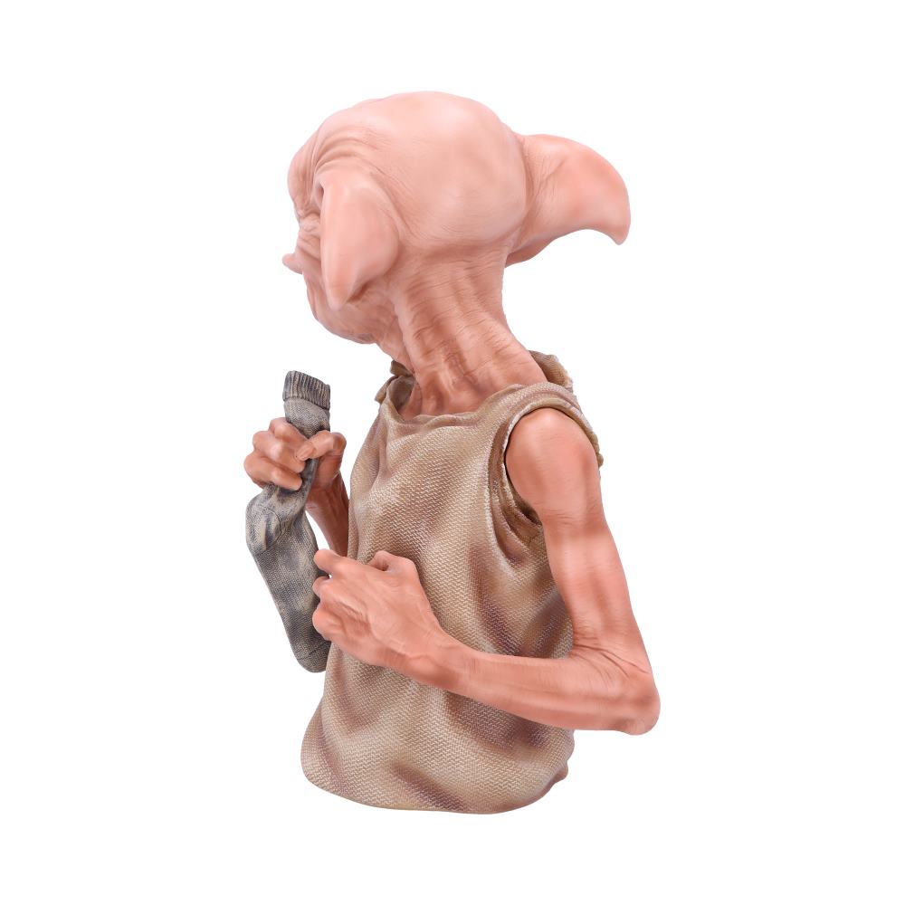 A small creature with large ears holds a sock in its right hand. It wears a rugged, sleeveless garment. The background is plain white, emphasizing the figure.