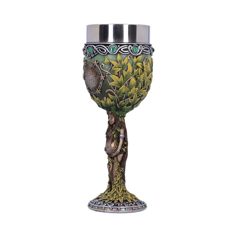 A chalice with a steel cup has a leafy, bulbous body; a pregnant woman with vines wrapping her, forms the stem and a leafy base, with small turquoise stones around it, sits on a white surface.
