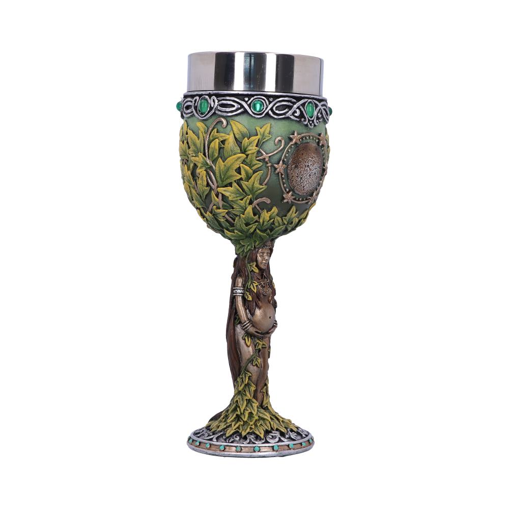 A decorative goblet features a stainless steel cup atop a green chalice adorned with leaves and jewels; a pregnant woman figure forms the stem, on a decorated base, against a white backdrop.