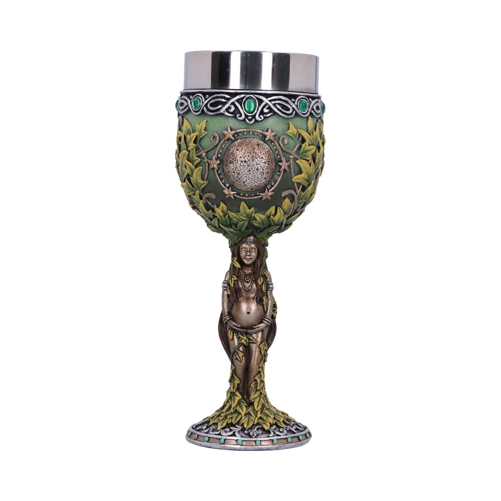 A decorative goblet features a silver cup supported by a green and gold ornate bowl, and a statue of a pregnant woman entwined with vines on a white background.