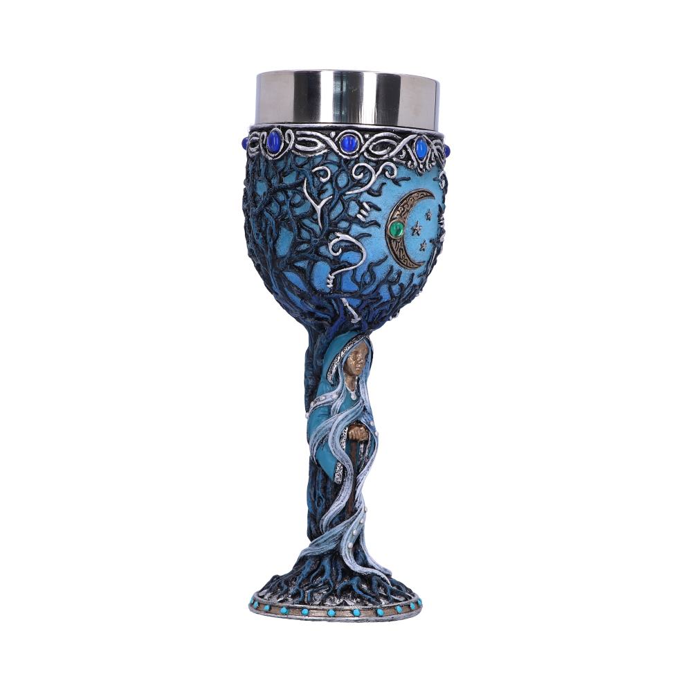 A decorative goblet, silver on top and detailed with a blue tree of life design and crescent moon, is standing on a base with blue-colored stones. A figure with a staff appears within the tree trunk.