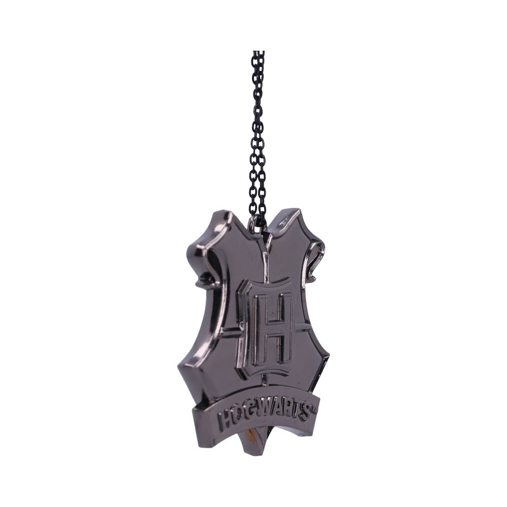A metallic pendant shaped like a shield hangs from a black chain, embossed with a large "H" and the word "HOGWARTS" below it, isolated on a white background.