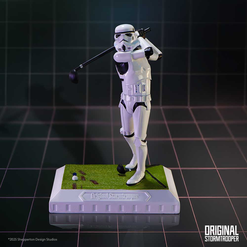 Stormtrooper golf figurine on a dark gridded studio background