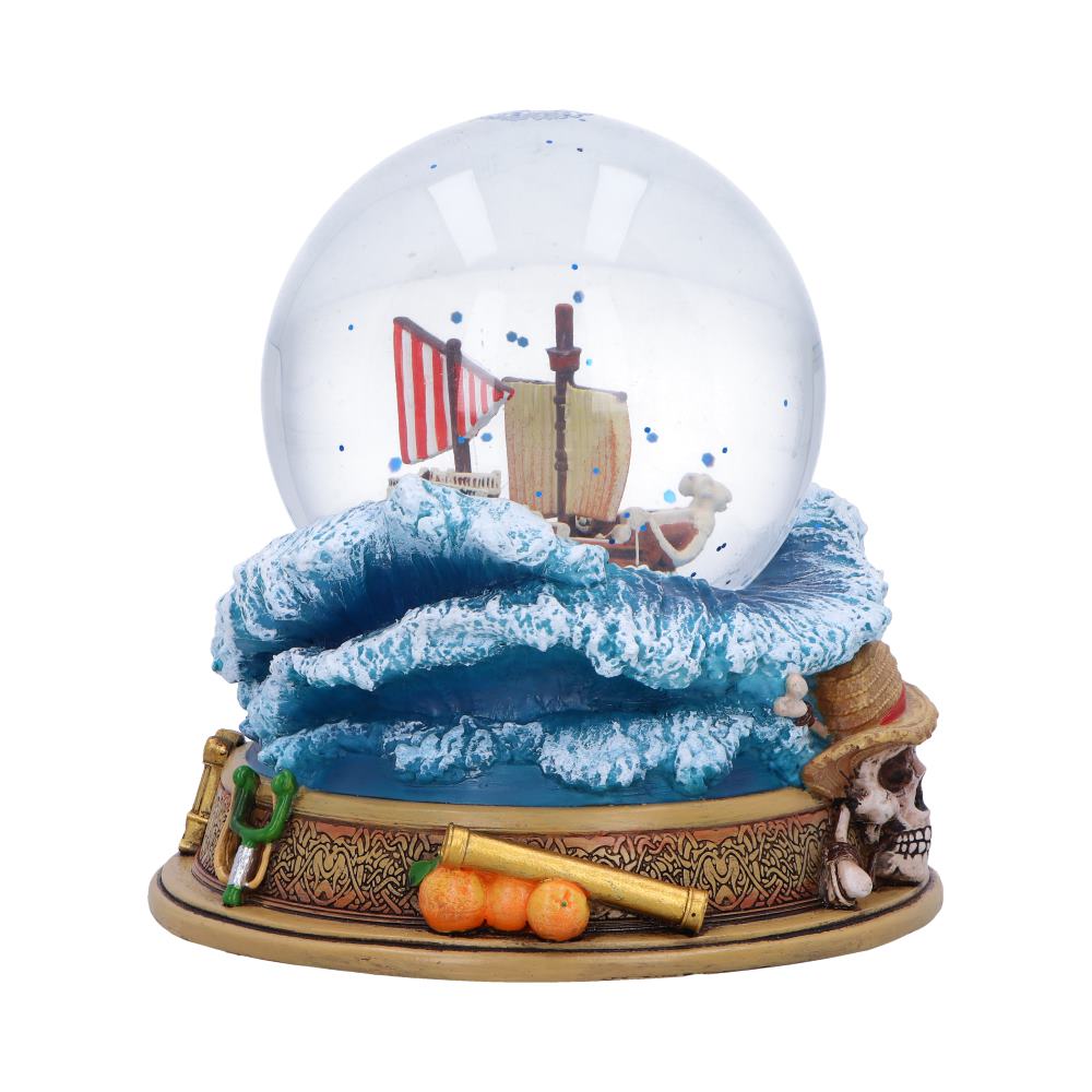 Side of Going Merry globe with striped sail and sculpted oranges on the base