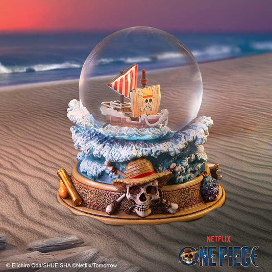 Going Merry glass snow globe on a nautical themed studio background