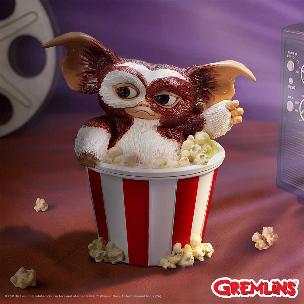Gremlins Gizmo Feast Box - displayed in a cinema-themed setting beside scattered popcorn props