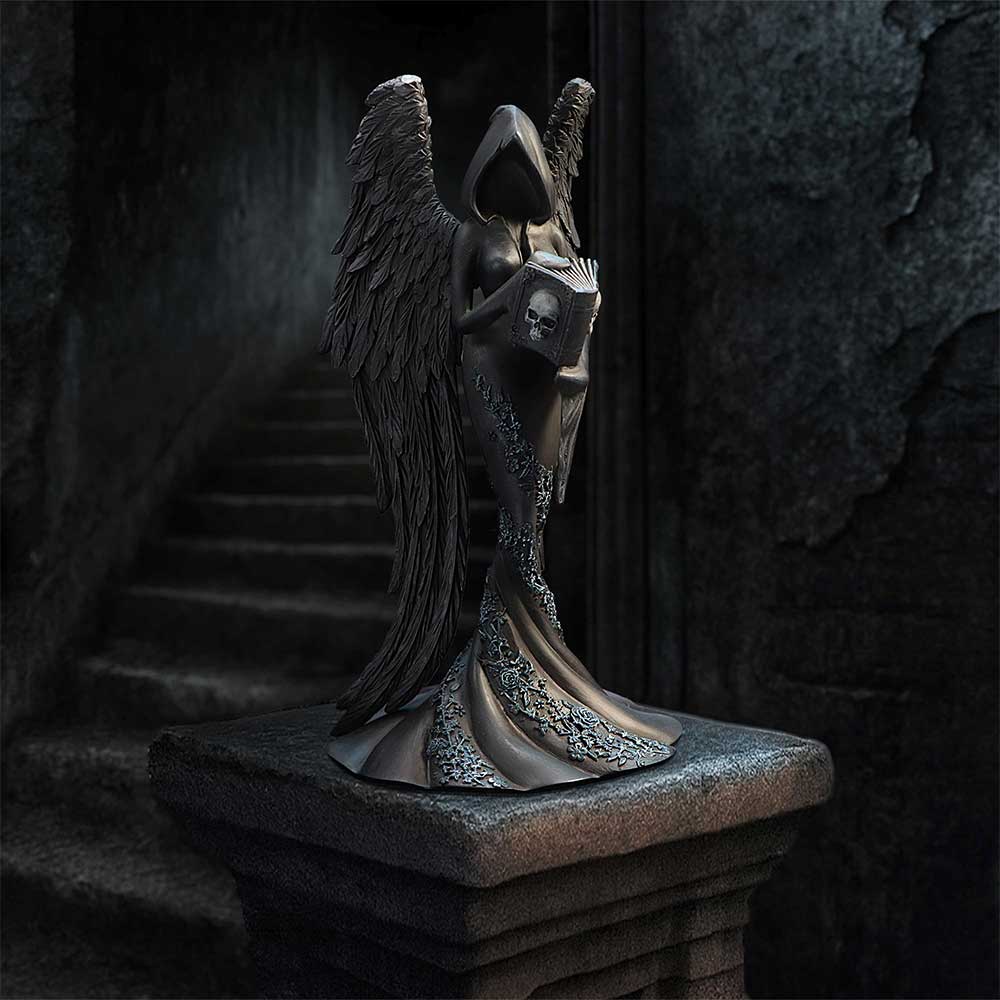 Femme Fatale Scholar Gothic Figurine - displayed in a dark architectural setting with the book held close
