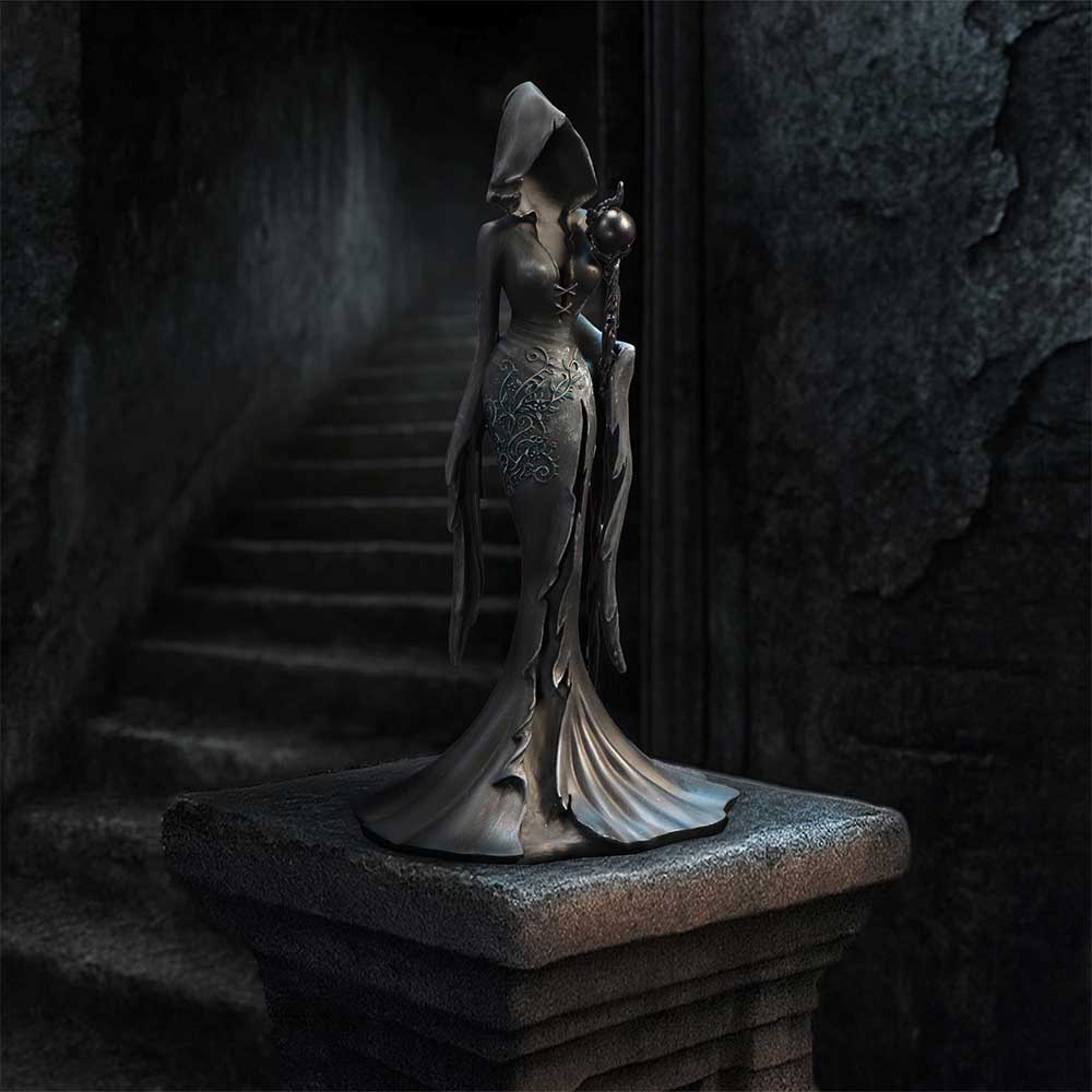 Femme Fatale Seer Gothic Figurine - displayed against dark stone with the raven-topped staff visible
