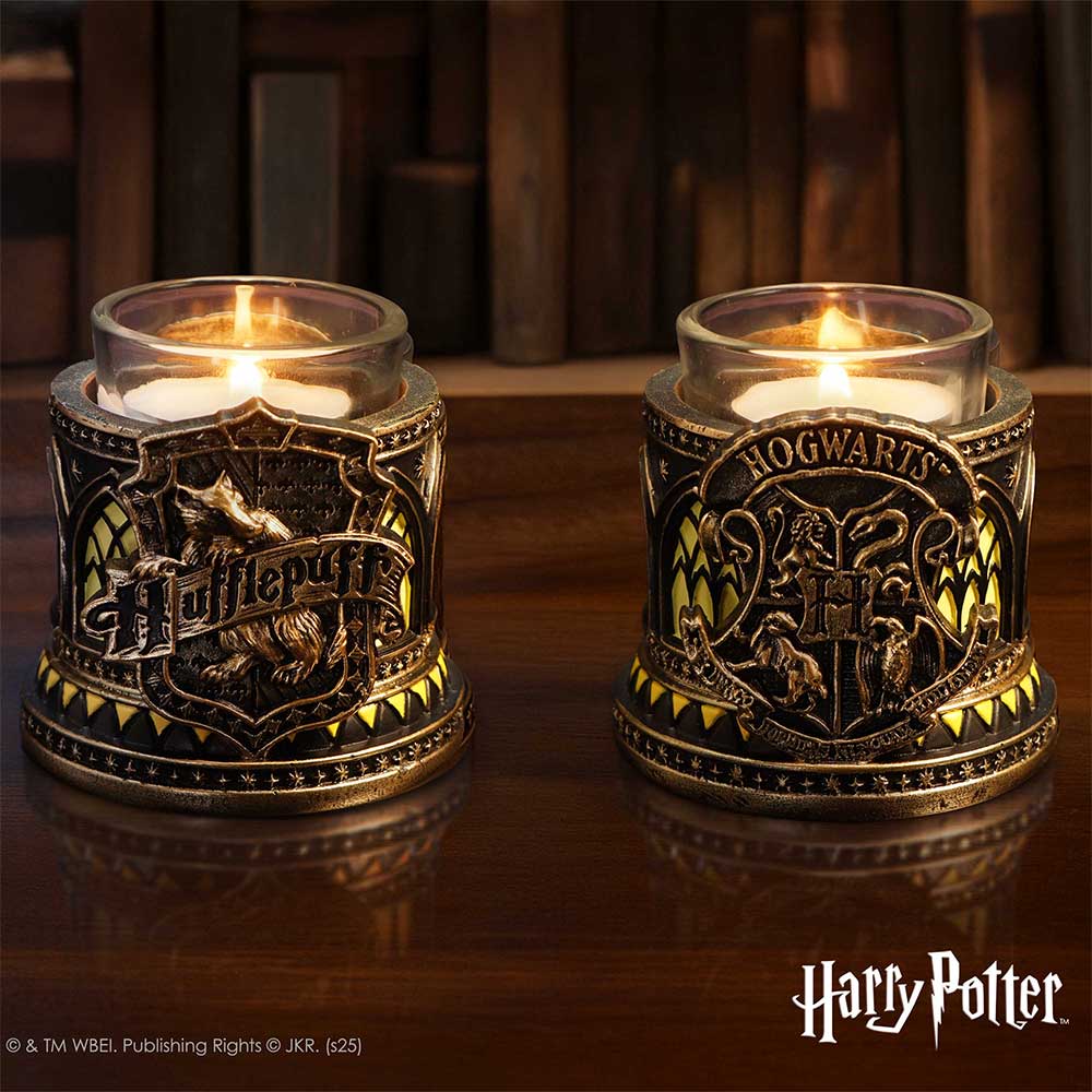 Harry Potter Hufflepuff Tealight Holder - two views of the holder displayed with a lit tealight, showing house and Hogwarts crests