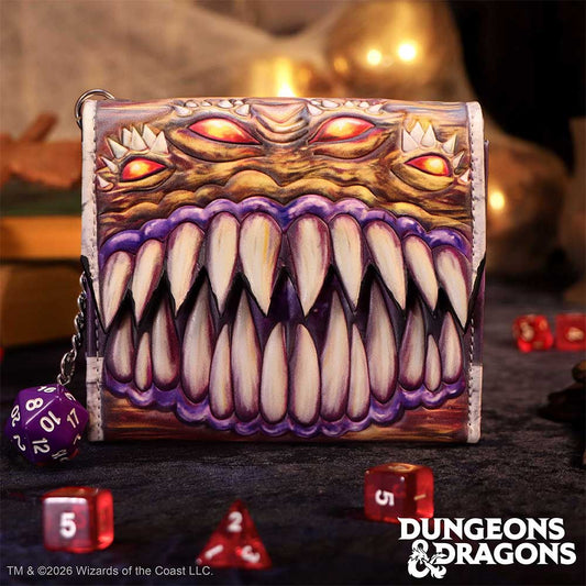 Dungeons & Dragons Mimic Wallet - displayed upright beside gaming dice props with the Mimic artwork facing forward
