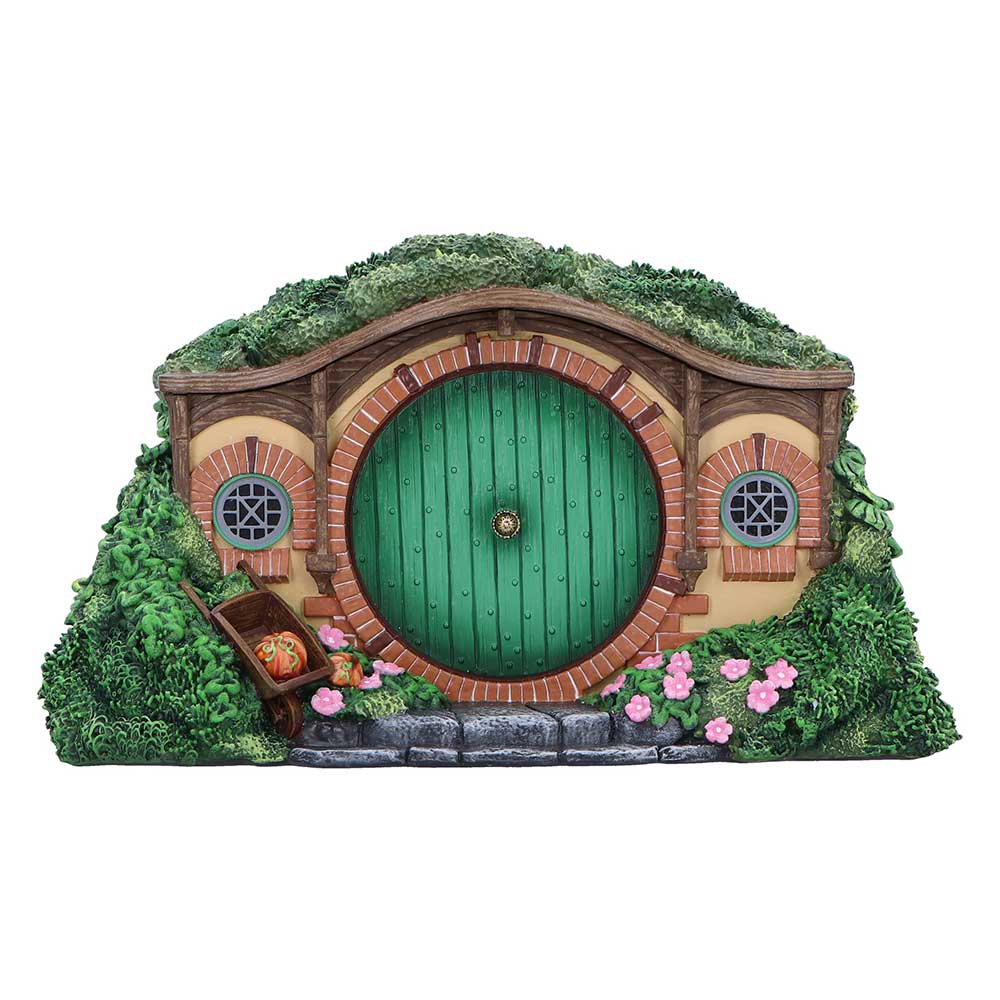 The Shire box with a round green door, flowering frontage and grass-like roof