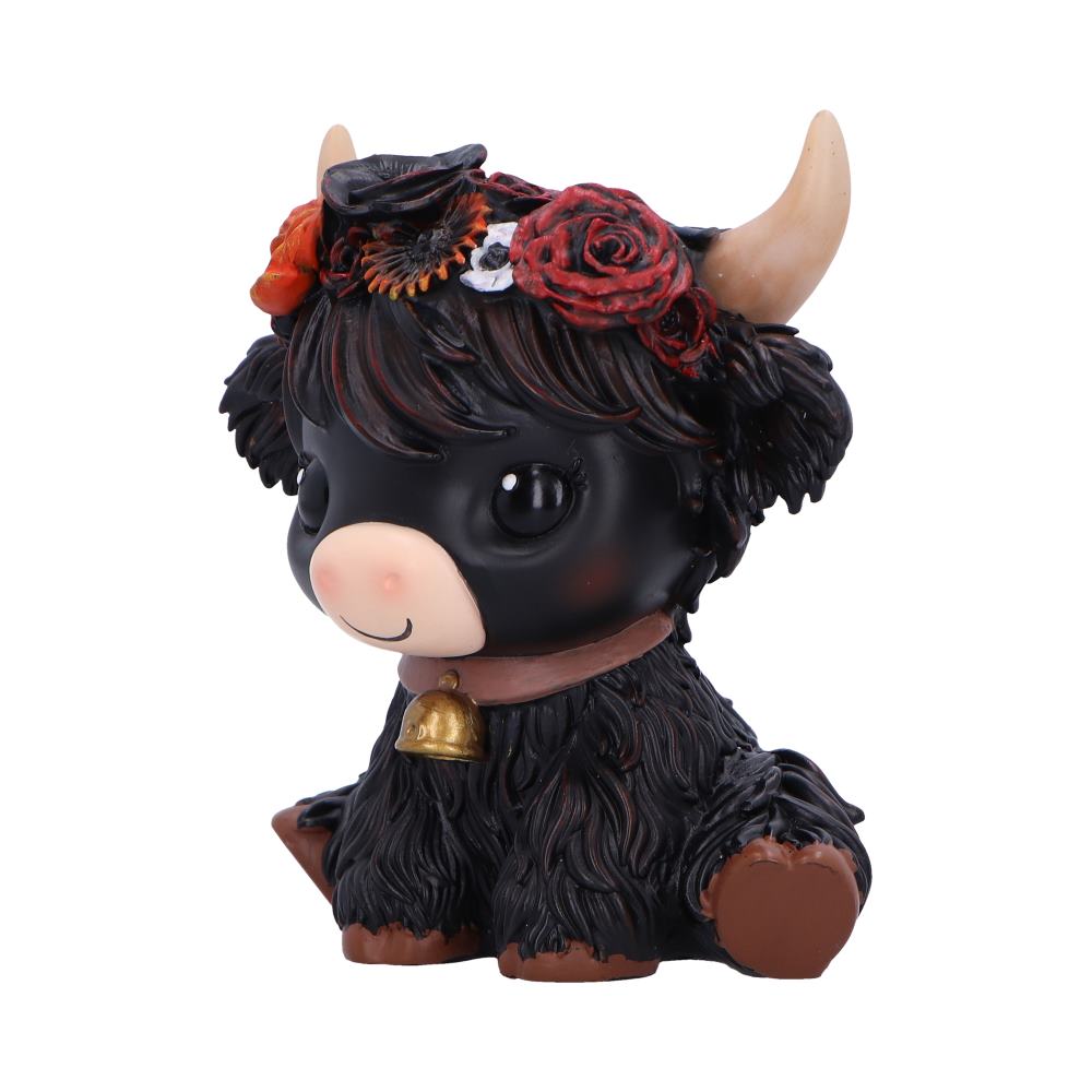 Moo Crew Dahlia Flower Cow Figurine - Angled view of warm red and orange flowers
