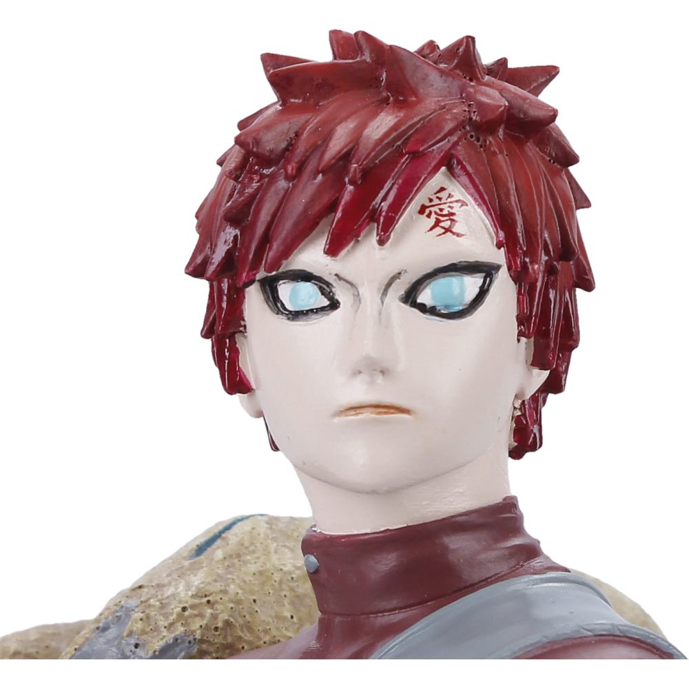 Close view of Gaara’s red hair, forehead marking and folded-arm pose