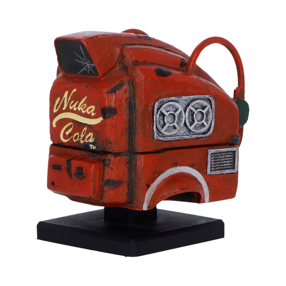 Fallout Nukatron Helmet Miniature - angled view showing weathered red panels, a looped fitting and side vent detail