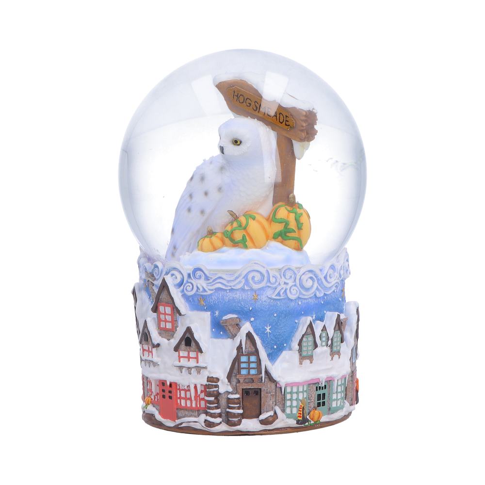 Harry Potter Hogsmeade Village Snow Globe - angled view of the owl above red-fronted houses around the base