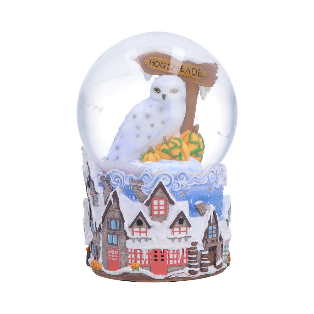 Harry Potter Hogsmeade Village Snow Globe - front with Hedwig, the Hogsmeade sign and snowy village houses
