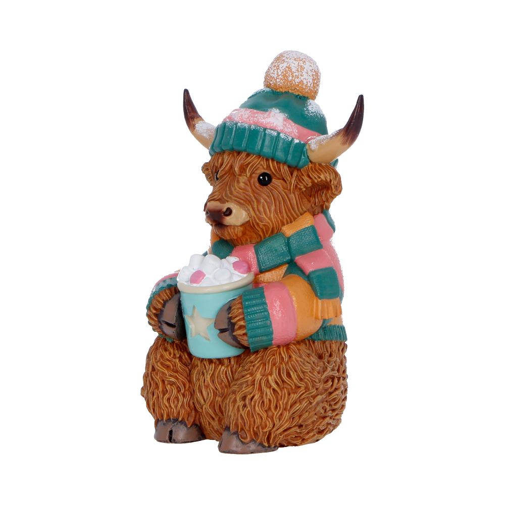 Winter Highland Cow Hot Cocoa Figurine - Angle of striped clothing and star-decorated mug