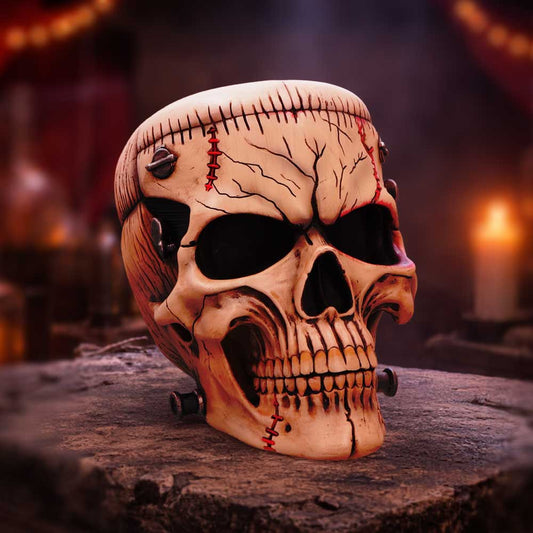 The Monster of Madness Hall of Horrors Frankenstein-inspired skull by Nemesis Now with stitched scars, cuts and metal neck bolt detailing
